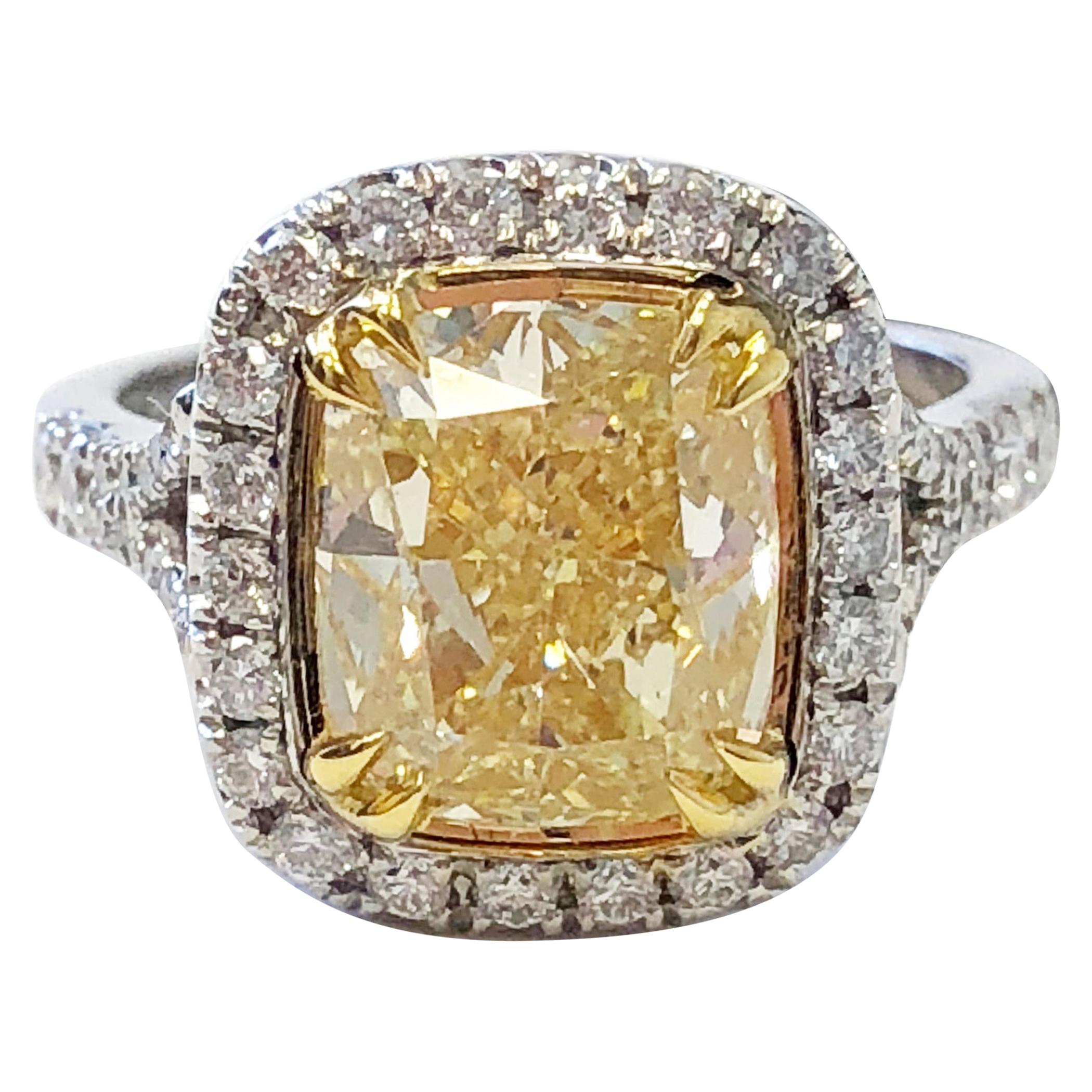 GIA Fancy Yellow Cushion Diamond and White Diamond Round Engagement Ring