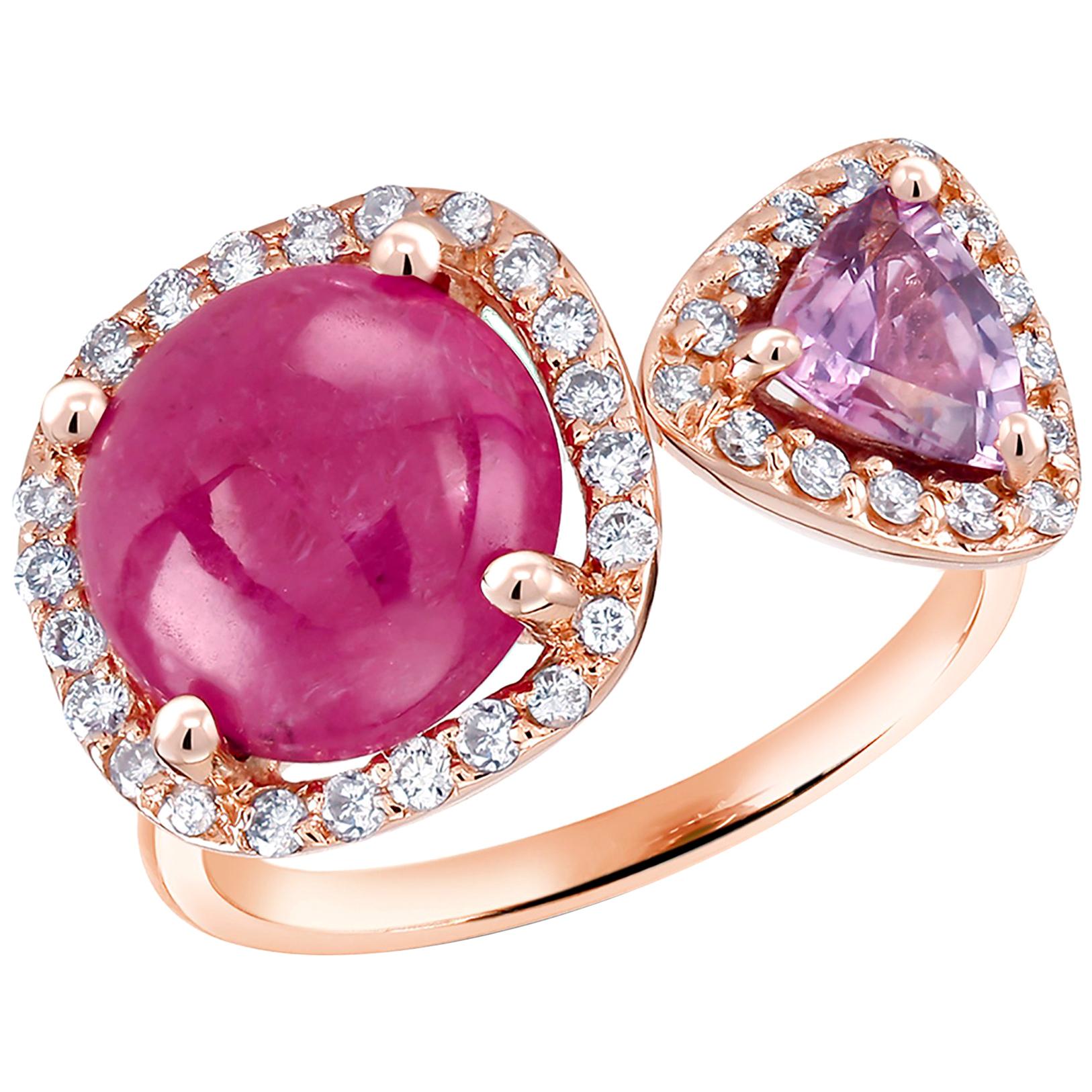 Eighteen karats rose gold cocktail open shank facing ring 
Round shape Burma cabochon ruby weighing 4.57 carat  
Trillion Ceylon Pink sapphire weighing 0.65 carat
Diamond weighing 0.70 carat                                                           