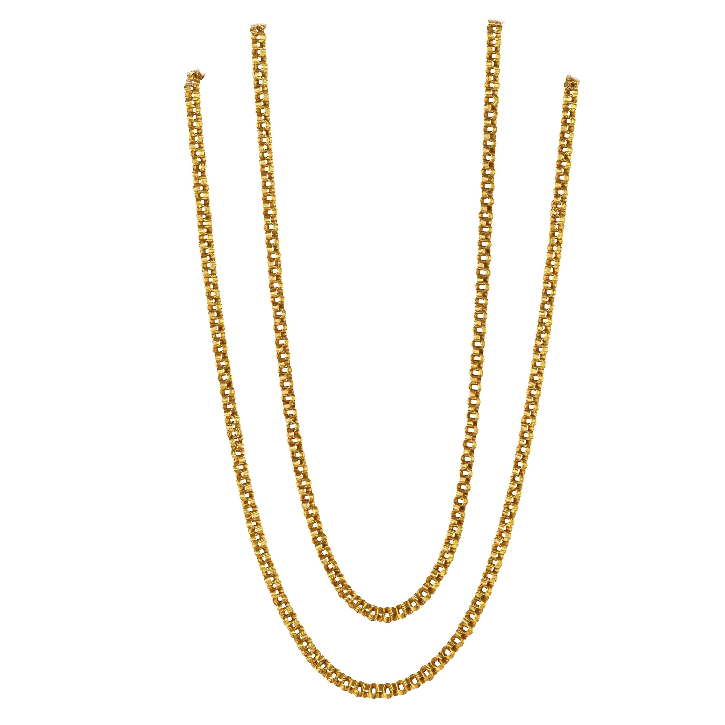 A spectacular Russian 14k yellow gold long chain from the Romanov era, period of Tsar Nicholas II, of classic inspiration designed as a series of interconnected round links, each comprising six conjoined round loops.

Moscow, 1908-17.

54 in. (137.2