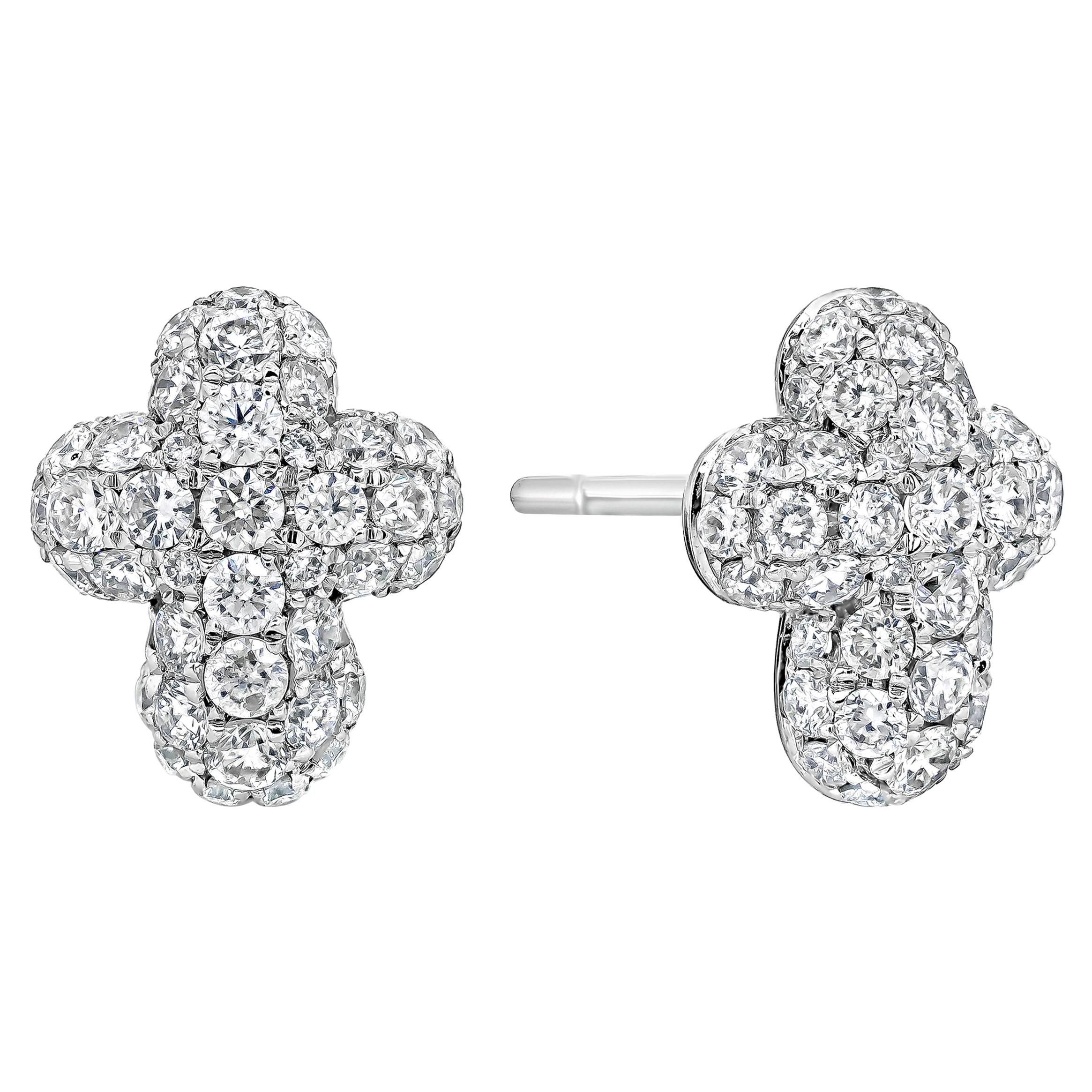 This pair of earrings showcasing a small and simple cross-shaped stud earrings encrusted with round brilliant diamonds weighing 1.30 carats total, set in a micro-pave design. Made in 14K White Gold.

Roman Malakov is a custom house, specializing in