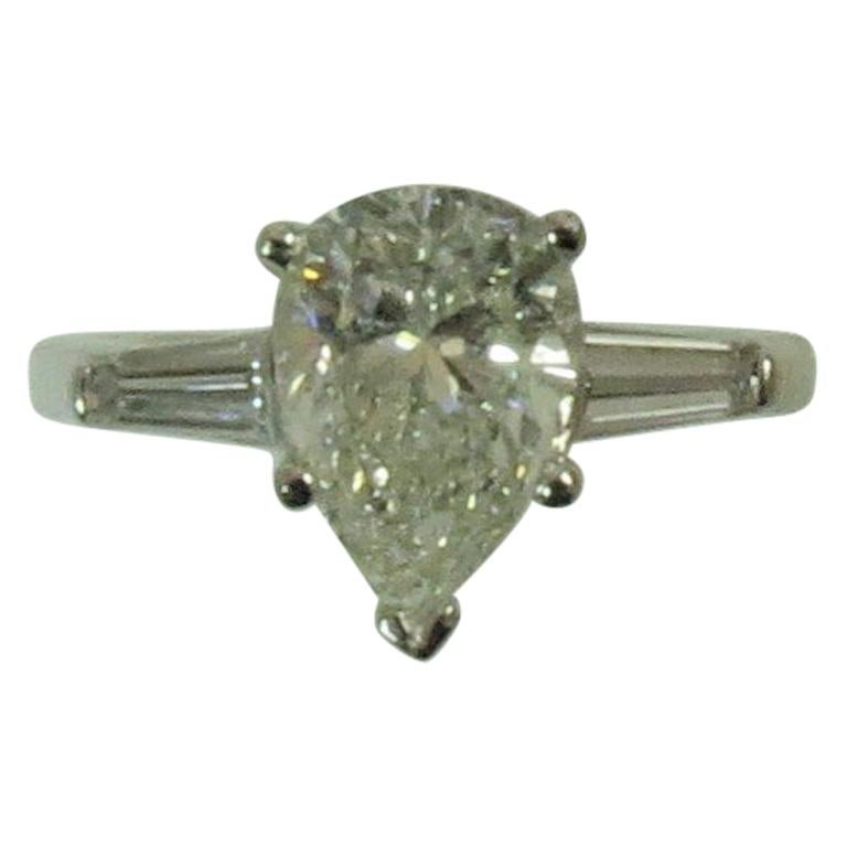 Platinum Ring  Prong Set With Pear Shape Diamond Weighing 2.02cts and Baguettes For Sale