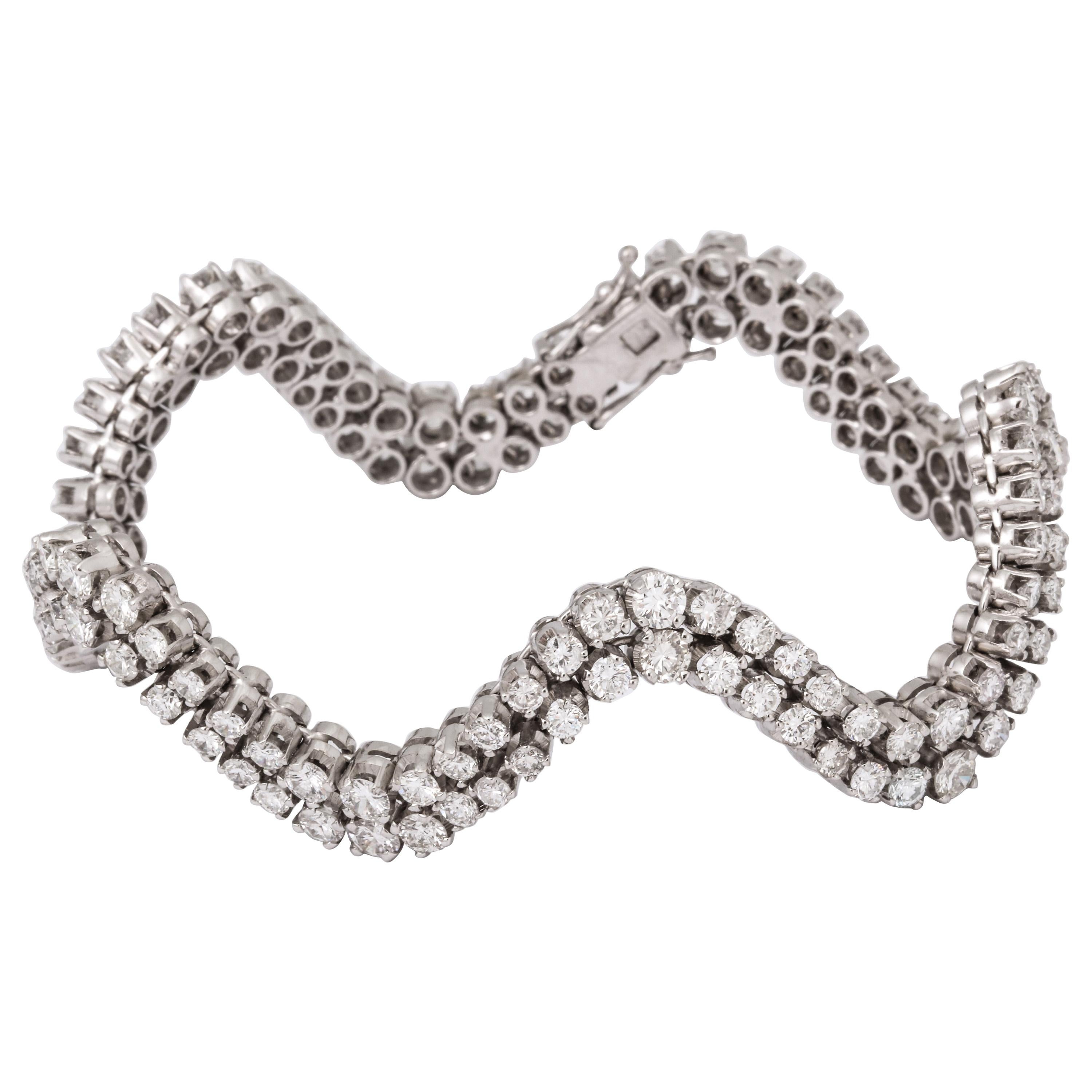 This is a very stunning diamond bracelet with incredible design. It is comprised of 14.5 carats of fine quality diamonds set in 18K white gold.