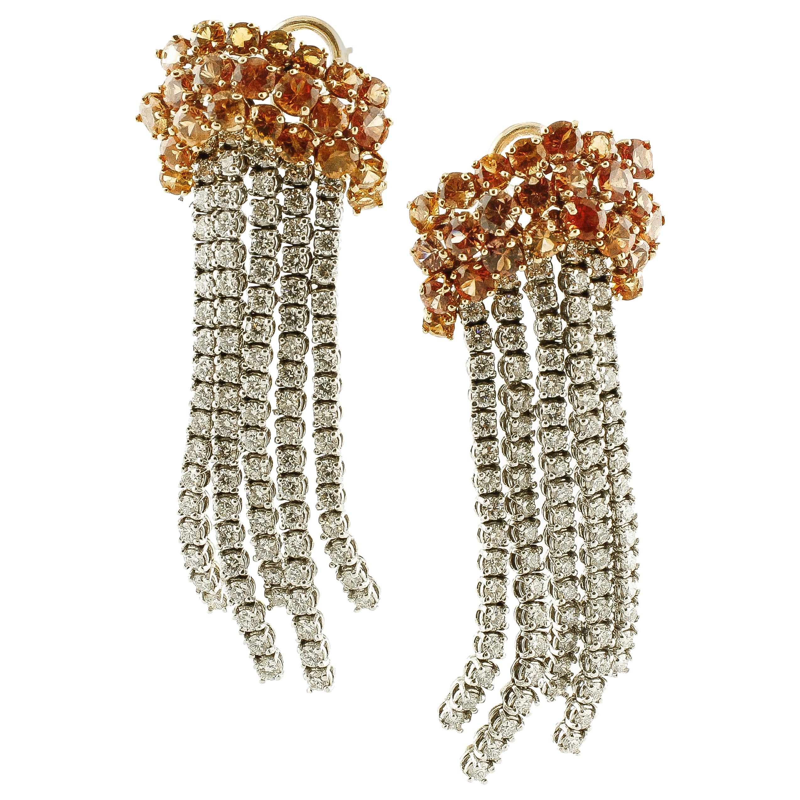 Boucles d'oreilles pendantes en or rose avec saphirs et diamants