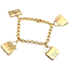 Hermes 4 Hanging Bag Charm Gelbgold-Gliederarmband