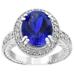 Bague en or blanc 14 carats avec tanzanite ovale de 6 carats et diamant de 1 carat, ancienne propriété