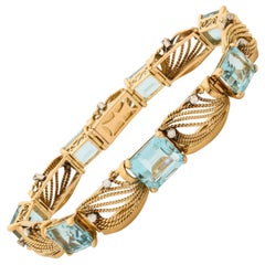 1950s Flexible Emerald Cut Aquamarine with Diamonds Gold Ropework Bracelet