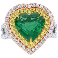 Halo 9.33 Carat Emerald Heart Shape Diamond Three-Stone 18 Karat White Gold Ring