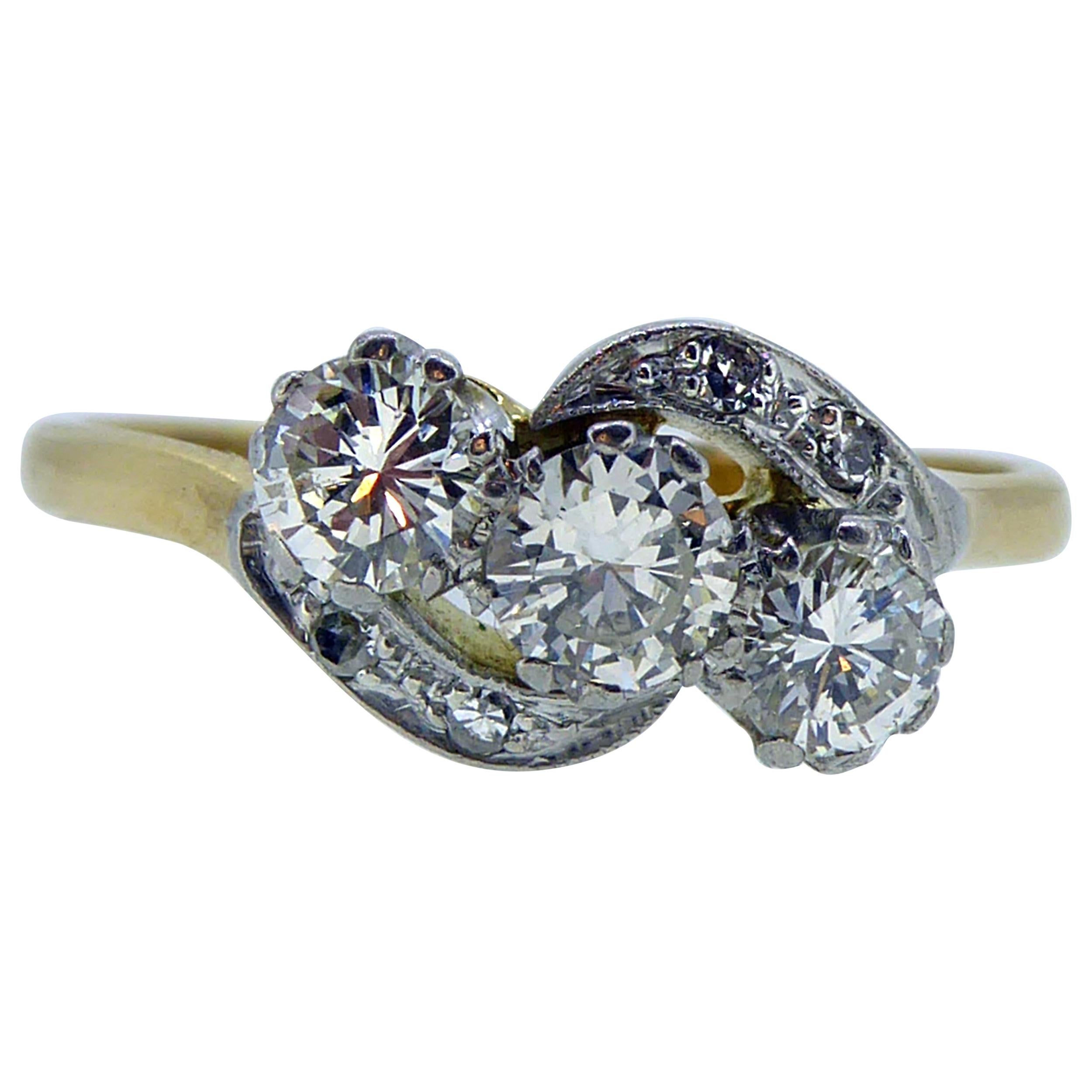 Art Deco Diamond Three-Stone Ring, 0.74 Carat Cross-Over Twist Diamond Shoulders