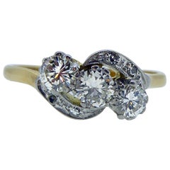 Art Deco Diamond Three-Stone Ring, 0.74 Carat Cross-Over Twist Diamond Shoulders