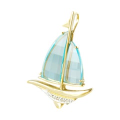 7 Carat Blue Topaz and 14 Karat Yellow Gold Sail Boat Pendant