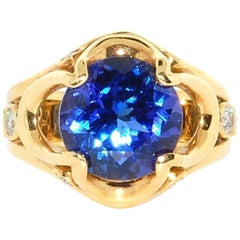 AAA Quality Very Fine Tanzanite in 18 Karat Yellow Gold with Diamonds Accents