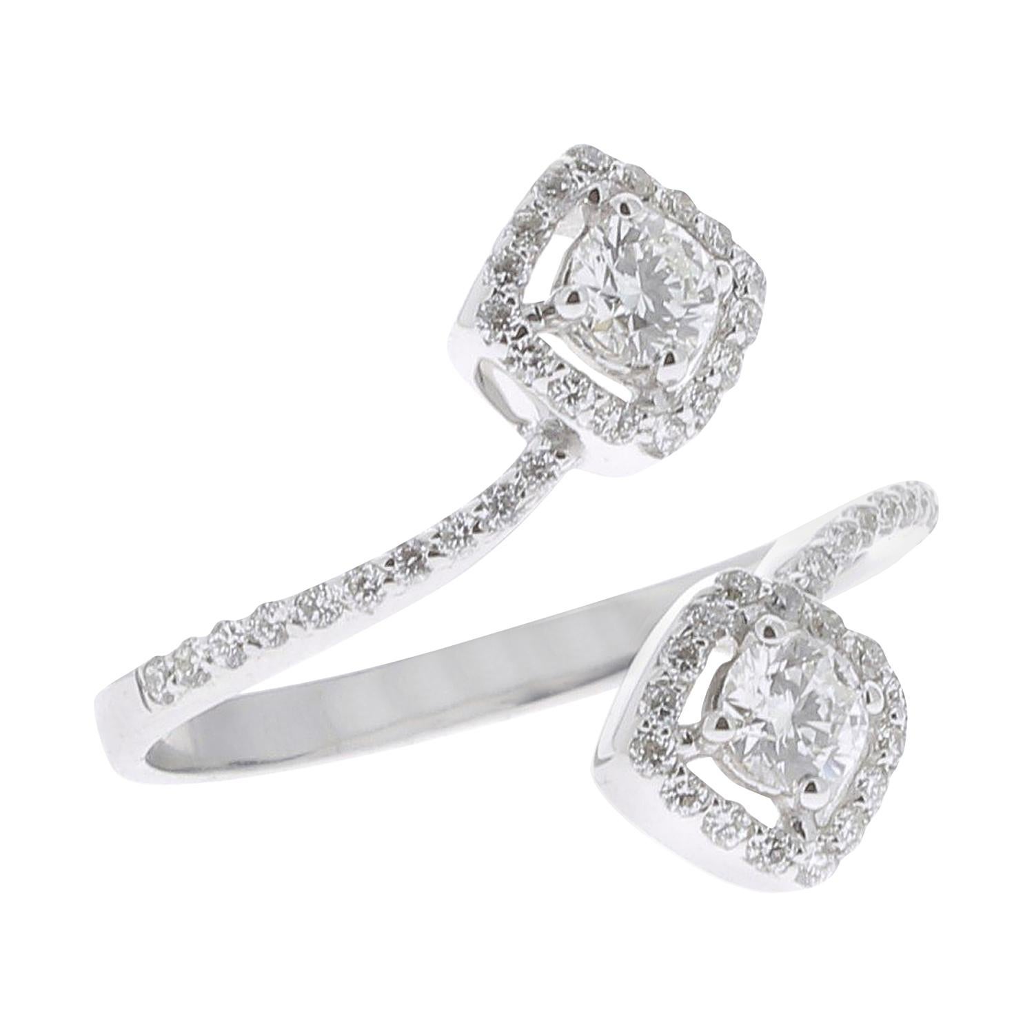 The Square Diamond Ring is a unique and trendy model set with 0.66 carats of GVS Diamond.
The Square Diamond ring is set with brilliants that wraps gracefully around the finger and whose end is punctuated with 2 diamonds on each side.
The Ring is