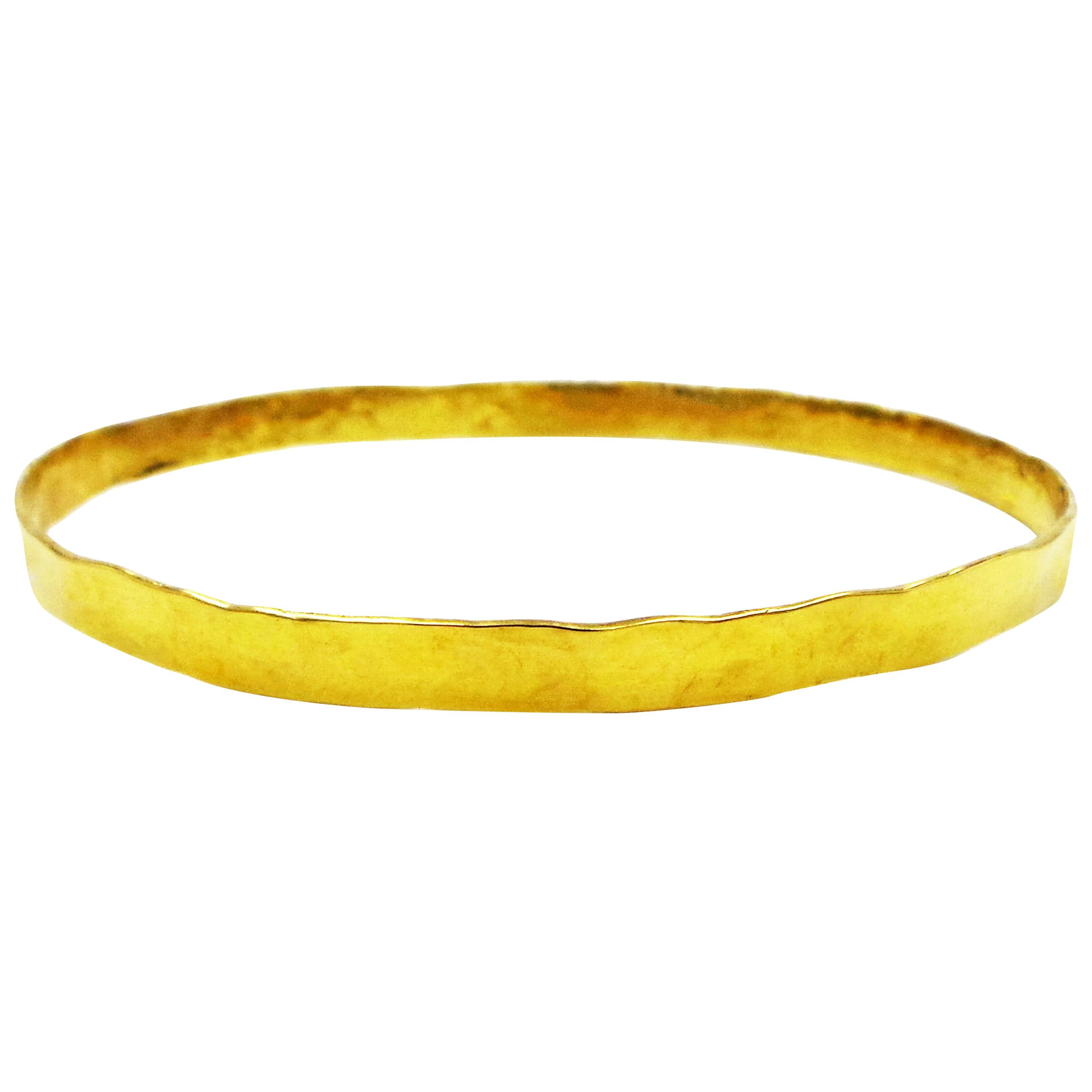 18 Karat Yellow Gold Hammered Skinny Bangle For Sale