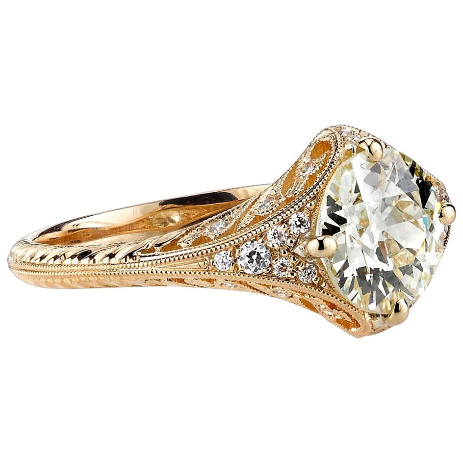 1.50ctw O-P/SI1 GIA certified old European cut diamond set in a handcrafted 18k yellow gold mounting. This ring features 0.11ctw old European cut accent diamonds along the head and shank.

Ring is currently a size 6 and can be sized to fit. 