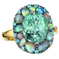 5, 52 ct. Lagoon Tourmaline, Black Opal, Paraïba Tourmaline Cocktail Ring