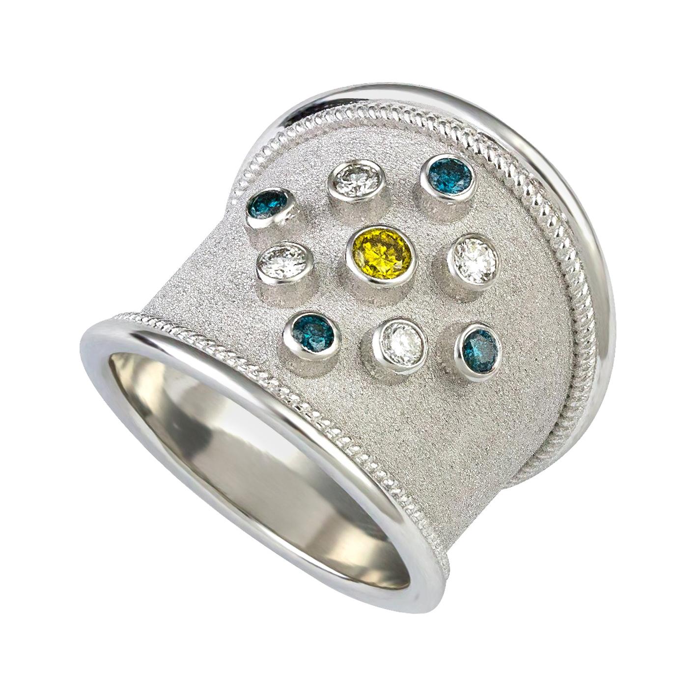 Georgios Kollektionen Dicker Ring aus 18 Karat Weißgold mit blauen, weißen und gelben Diamanten