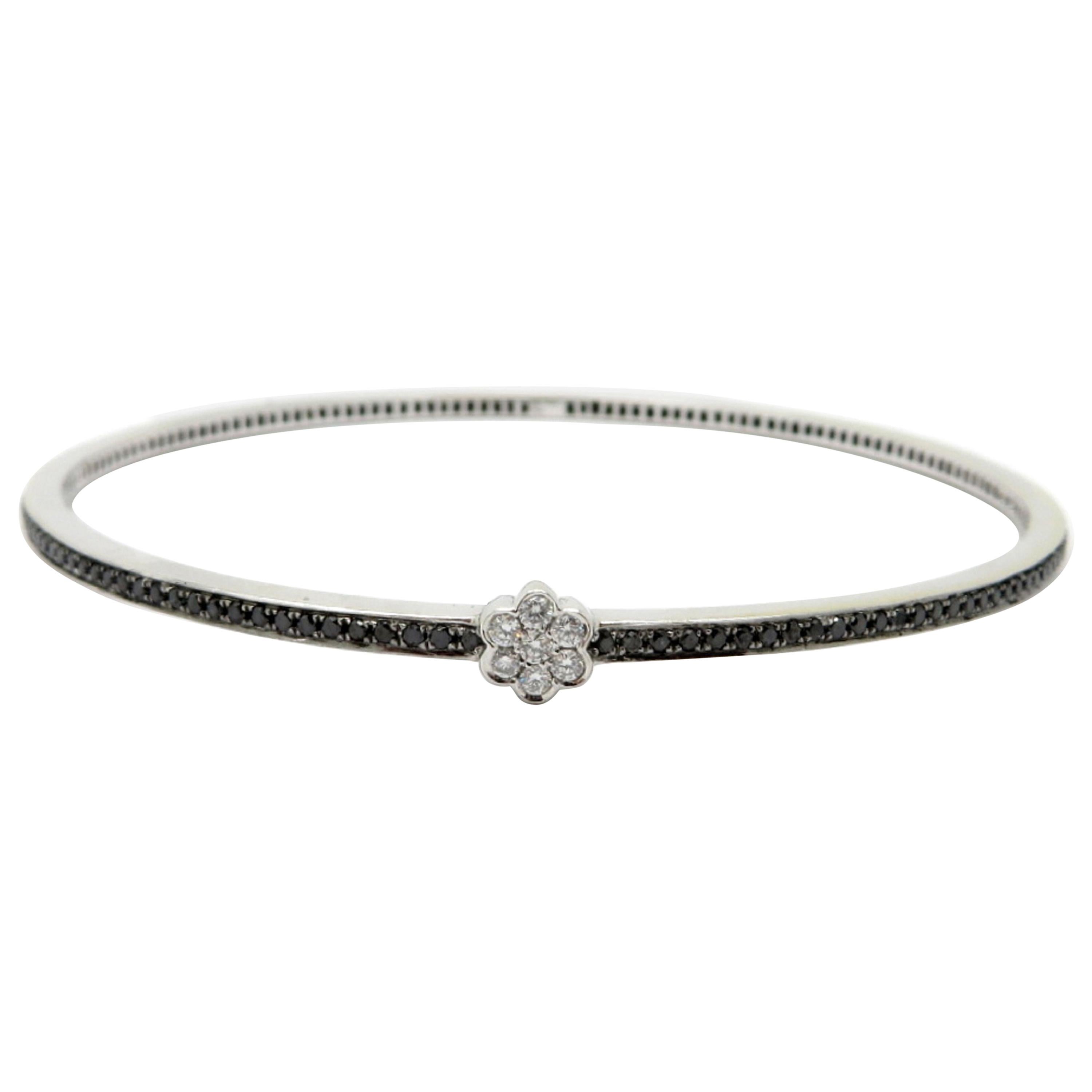 Estate 18 Karat White Gold White and Black Diamond Flower Bangle Bracelet For Sale