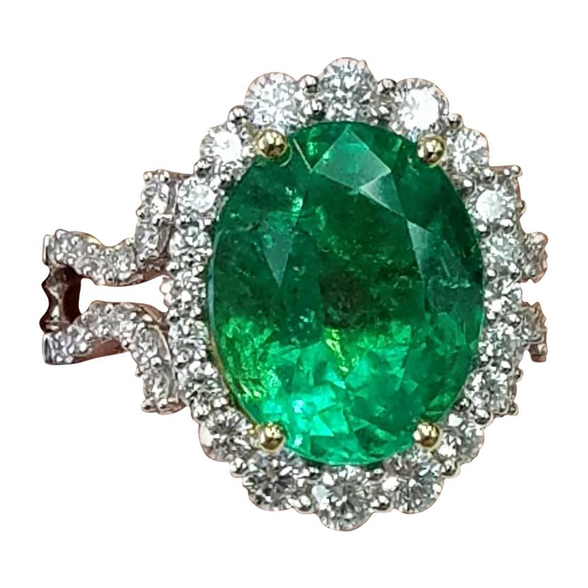 GIA Certified 18 Karat Oval Cut Emerald and Diamond Ring