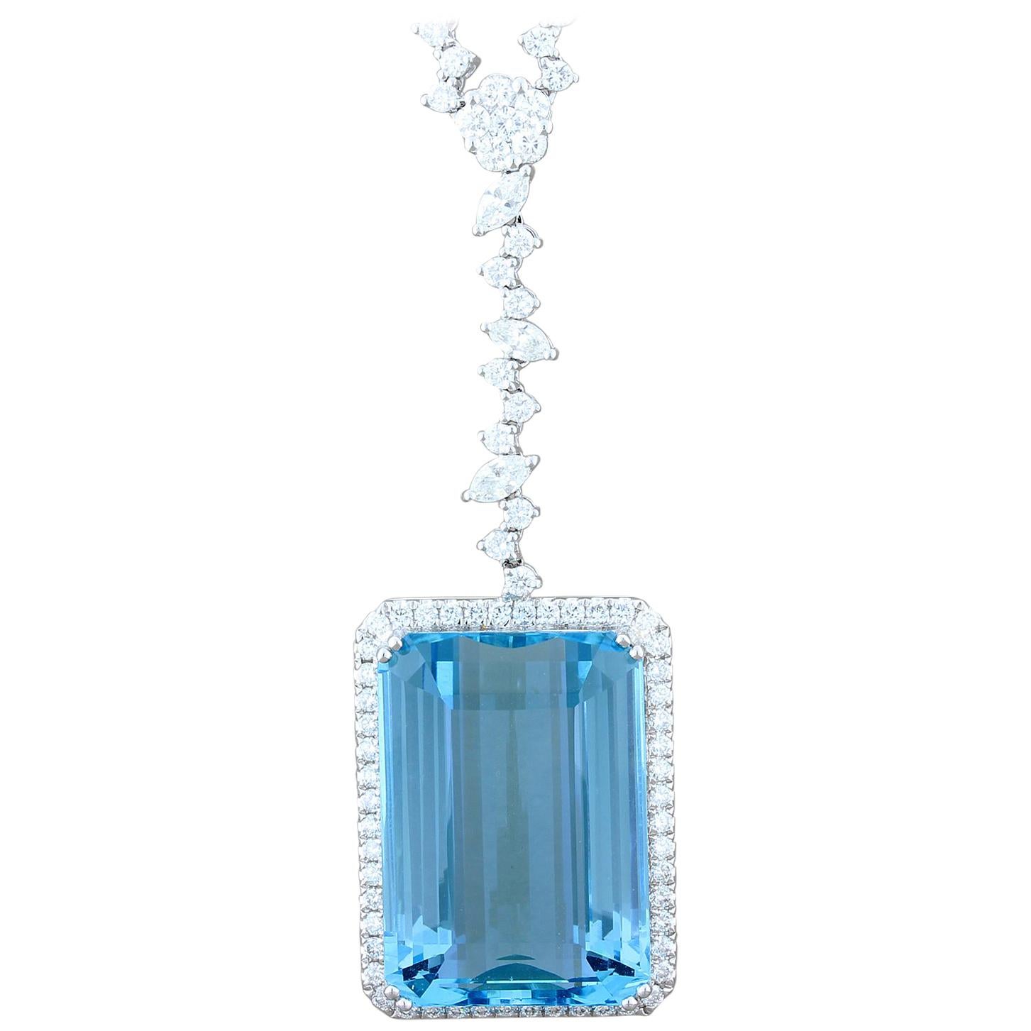 This breathtaking necklace features a fine 48.14 carat aquamarine. This aquamarine has the most sought after blue color. Being an emerald cut makes it even more special and desirable. The astounding aquamarine is haloed by 3.90 carats of VS quality