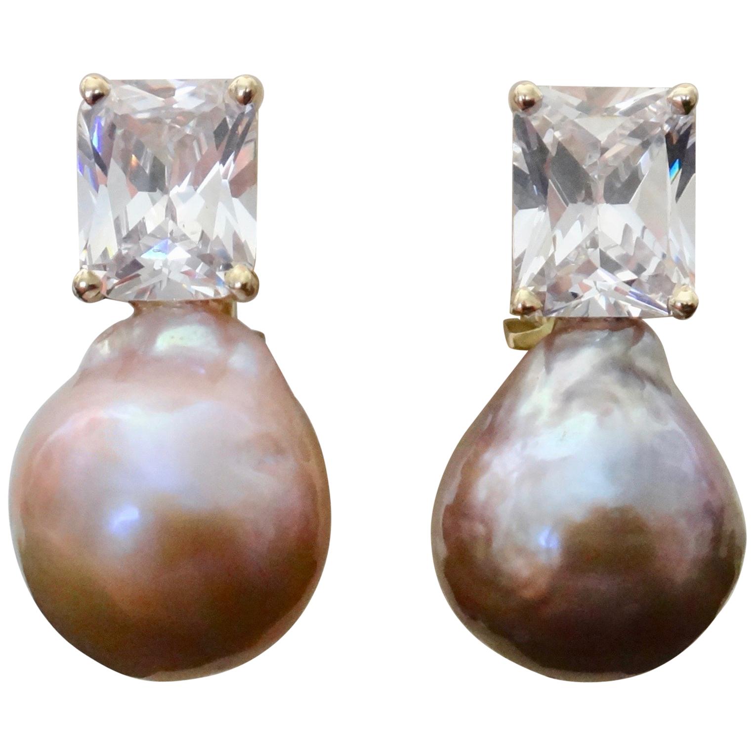 A brilliant pair of pink Kasumi pearls (origin: Japan) are paired with radiant cut white sapphires in these classic drop earrings.  Kasumi pearls are famous for their rich colors and metallic finish.  They measure 17mm long and along with the