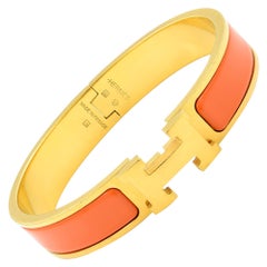 Gold Tone Hermes Orange Clic Clac Bangle Bracelet