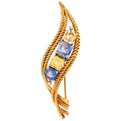 1960s Natural Yellow Blue Sapphire Diamond 18 Karat Gold Scroll Pin Brooch
