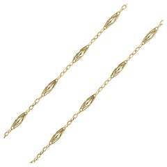 1900s Belle Époque Openwork Shuttlecraft Motifs Yellow Gold Chain