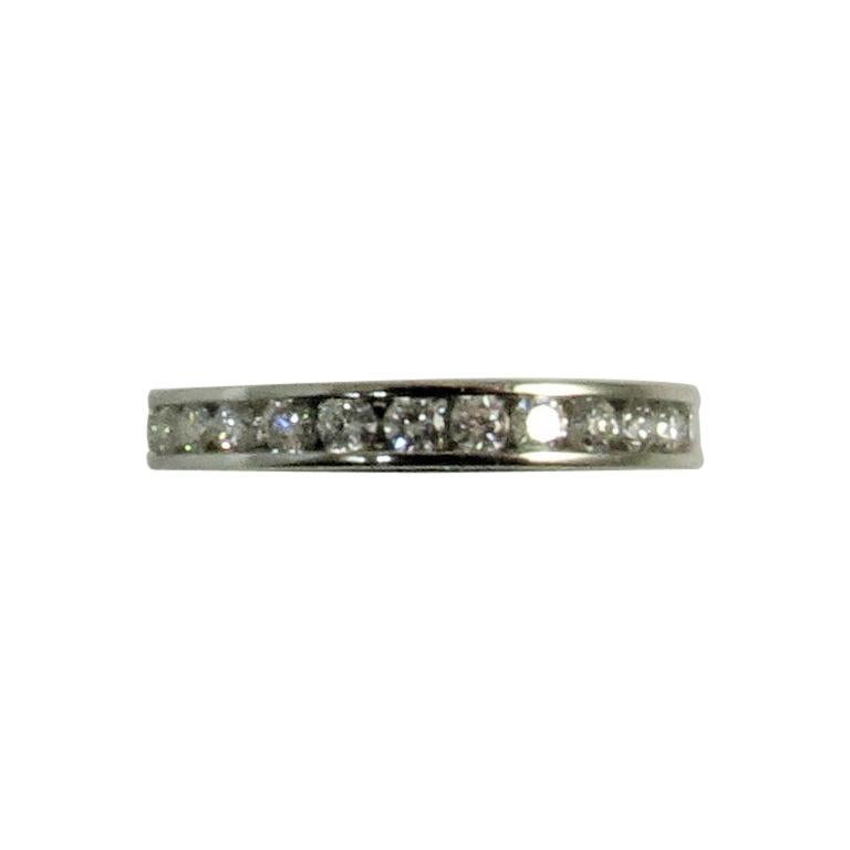 Platinum Channel Set Band Ring with Round Diamonds Weighing .95 Carat For Sale