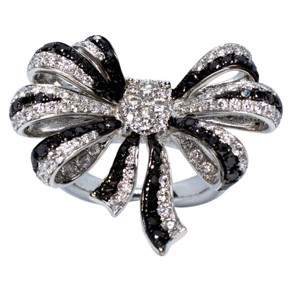 Estate Art Deco Style 18 Karat White Gold Black and White Diamond Bow Ring For Sale