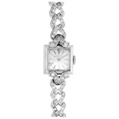 Gubelin Montre habillée vintage en or blanc et diamants pour femmes