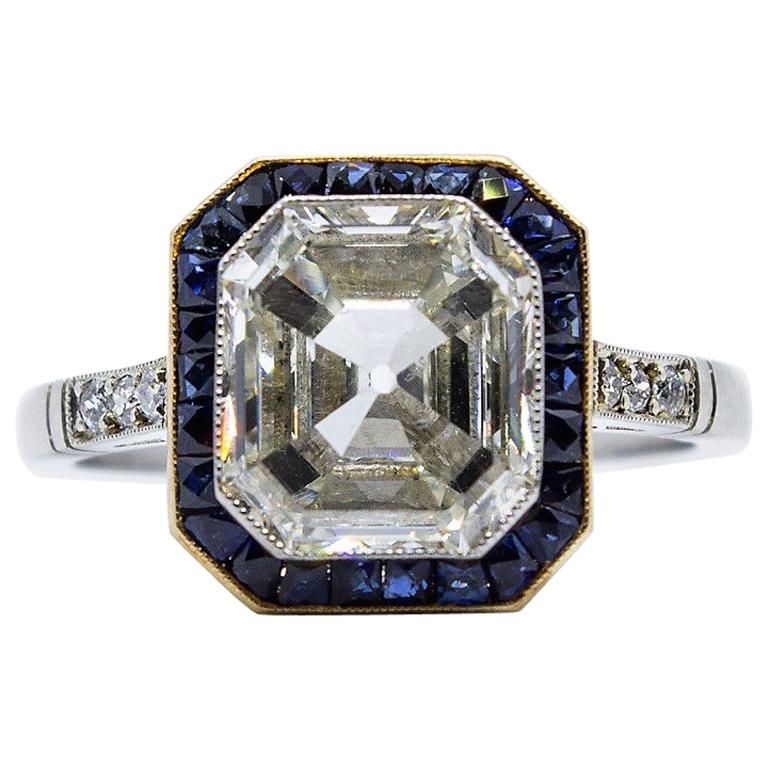 GIA Certified Platinum Emerald Cut Diamond and Sapphire Engagement Ring