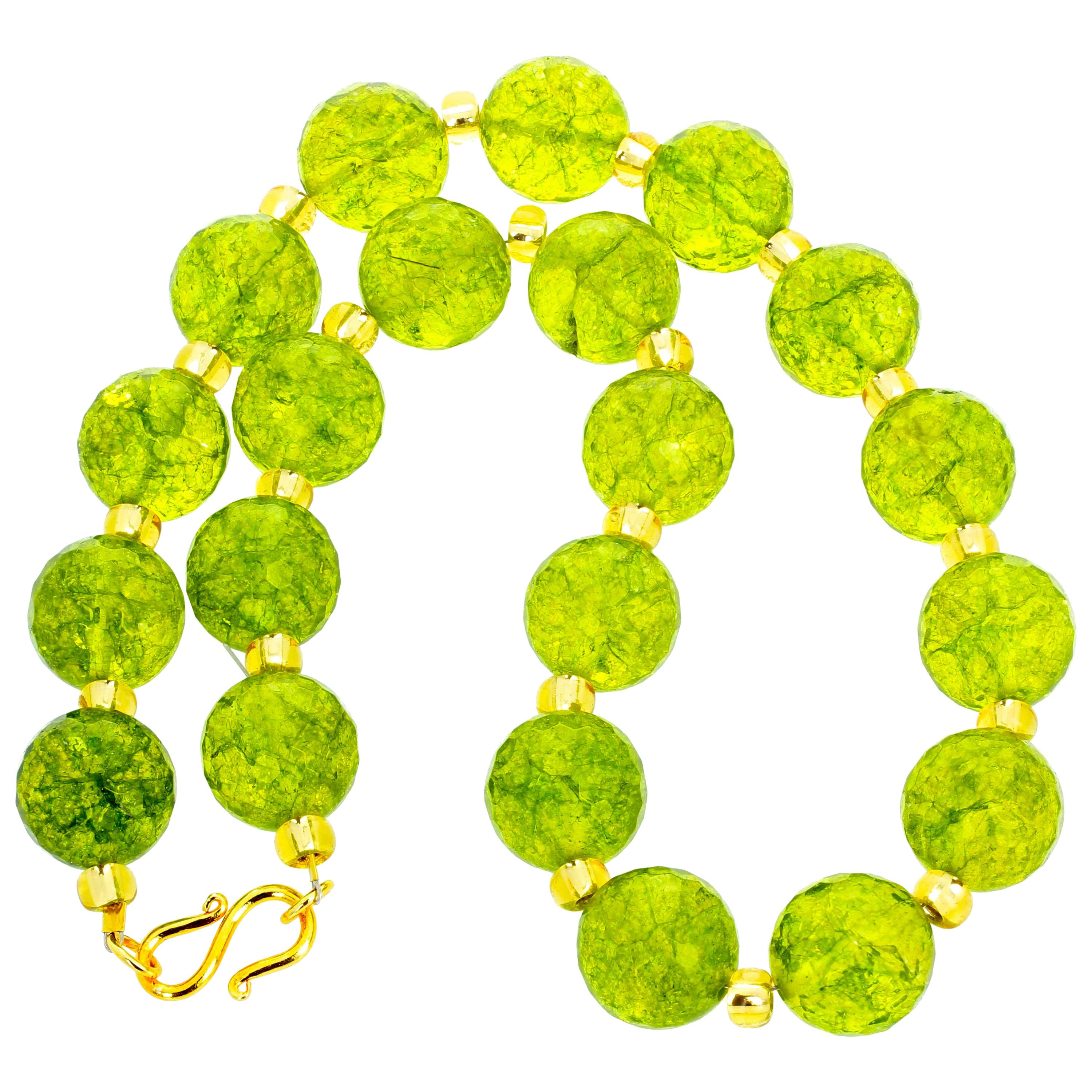 This unique 18 inch long checkerboard gem cut and polished glittering brilliant Peridot necklace is enhanced with sparkly goldy Crystals and set with a hook gold plated clasp. The Peridot are the natural rock and are 15mm round.  