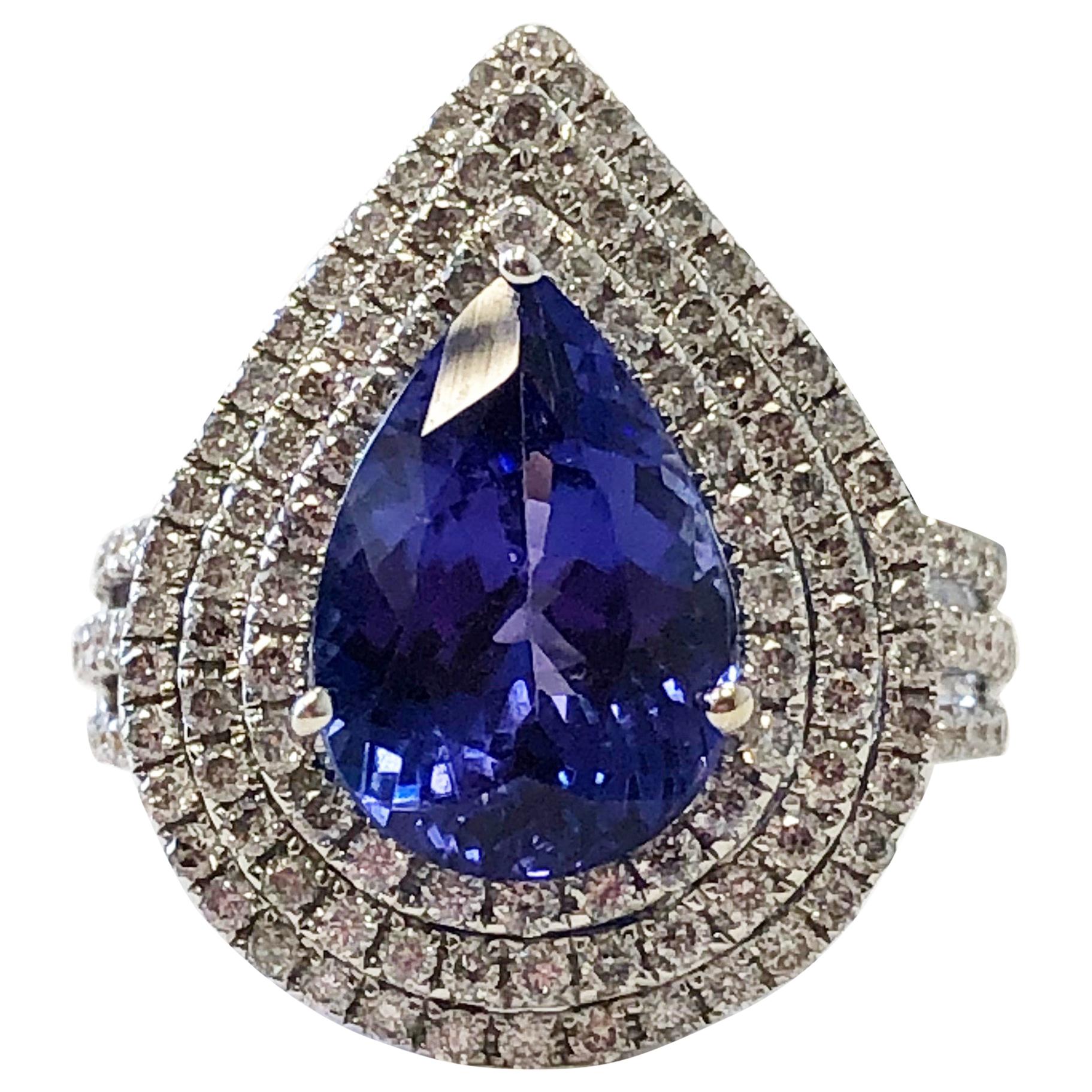 Blue Tanzanite Pear Shape and White Diamond Round Cocktail Ring in 18 Karat