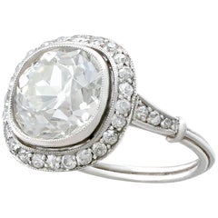 Antique and Contemporary 4.88 Carat Diamond and Platinum Halo Ring