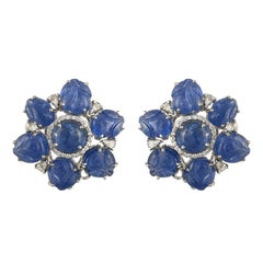 Set in 18K gold, natural Burmese Blue Sapphire carved and cabochon stud earrings