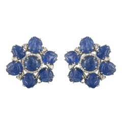 Set in 18K gold, natural Burmese Blue Sapphire carved and cabochon stud earrings