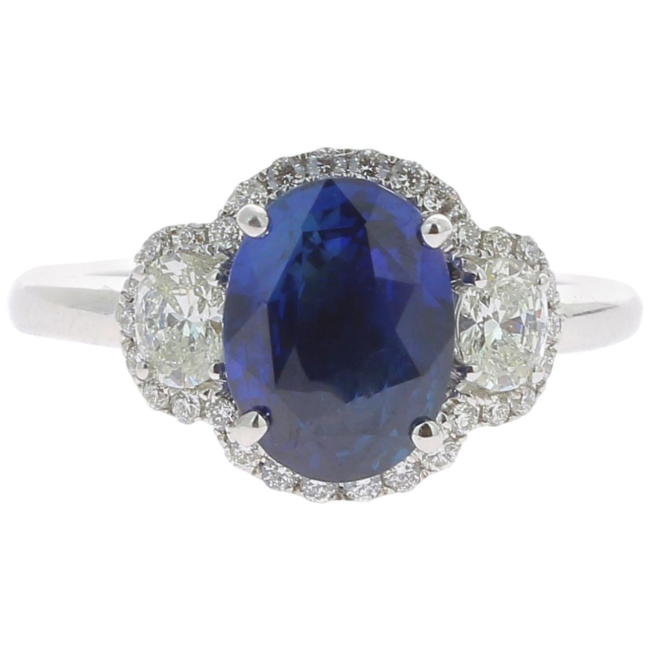 2.77 Carat Blue Sapphire Cocktail Ring Set with Oval and Round White Diamond 18K For Sale