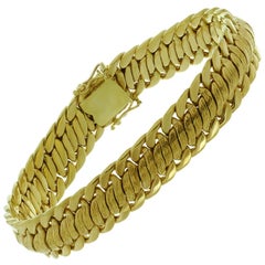 Bracelet tressé vintage en or jaune massif 18k.