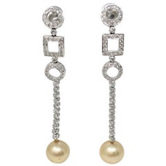 White Round Brilliant Diamond And South Sea Pearl Chandelier Earrings In 18k