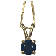 Deep Blue Australian Sapphire 0.57 Carat Round 18 Karat Gold Solitaire Pendant