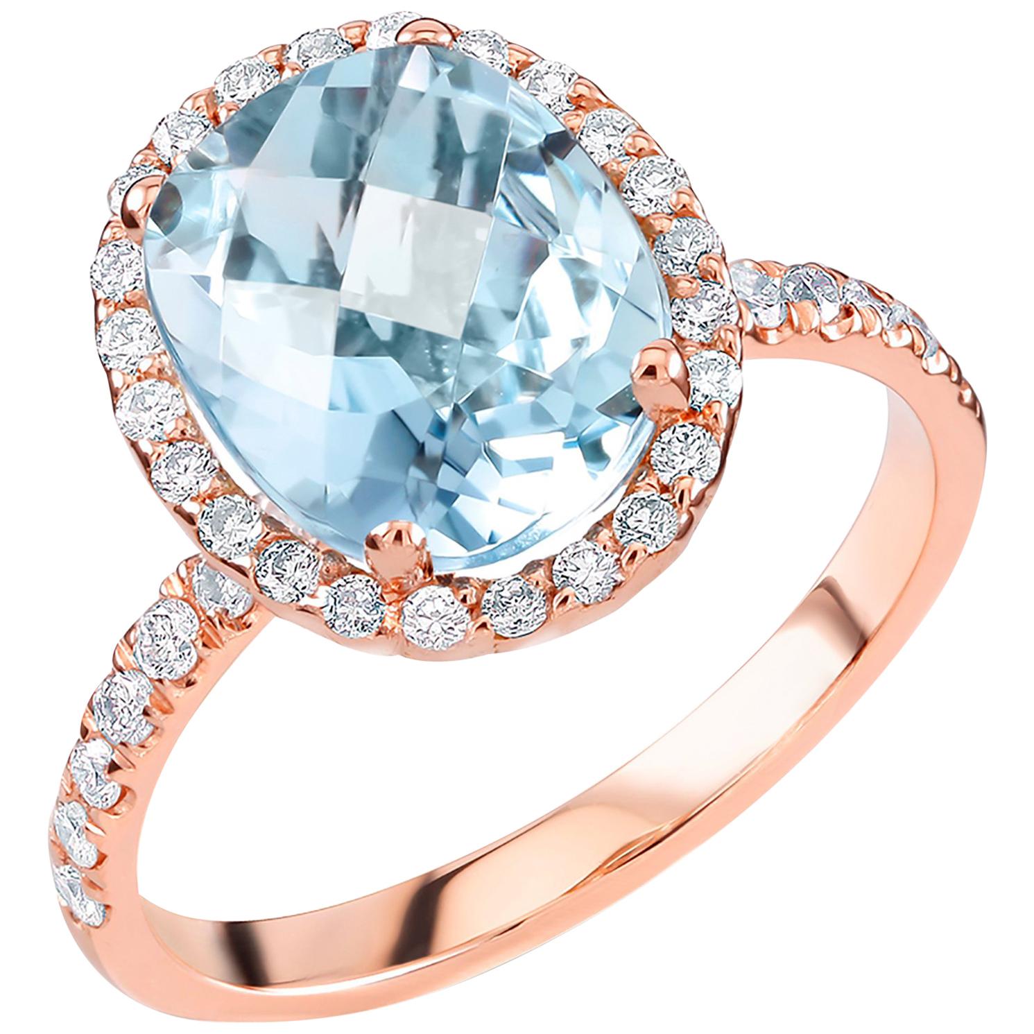 Eighteen karat rose gold cocktail cluster ring 
Oval shape aquamarine weighing 2.10 carat
Surrounded by  pave set diamonds weighing 0.65
Ring finger size 6 In Stock
New Ring
Ring can be resized 
Handmade in the USA
Our team of graduate gemologists