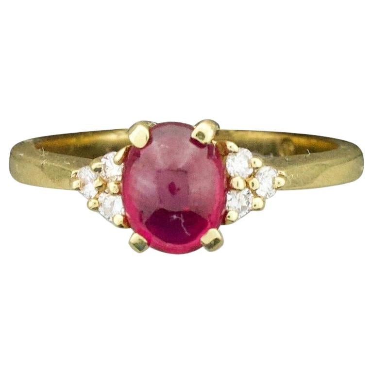 Delightful Cabochon Ruby and Diamond Solitaire Ring in 18 Karat For Sale
