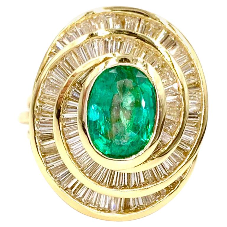 18 Karat Emerald and Diamond Swirl Cocktail Ring For Sale
