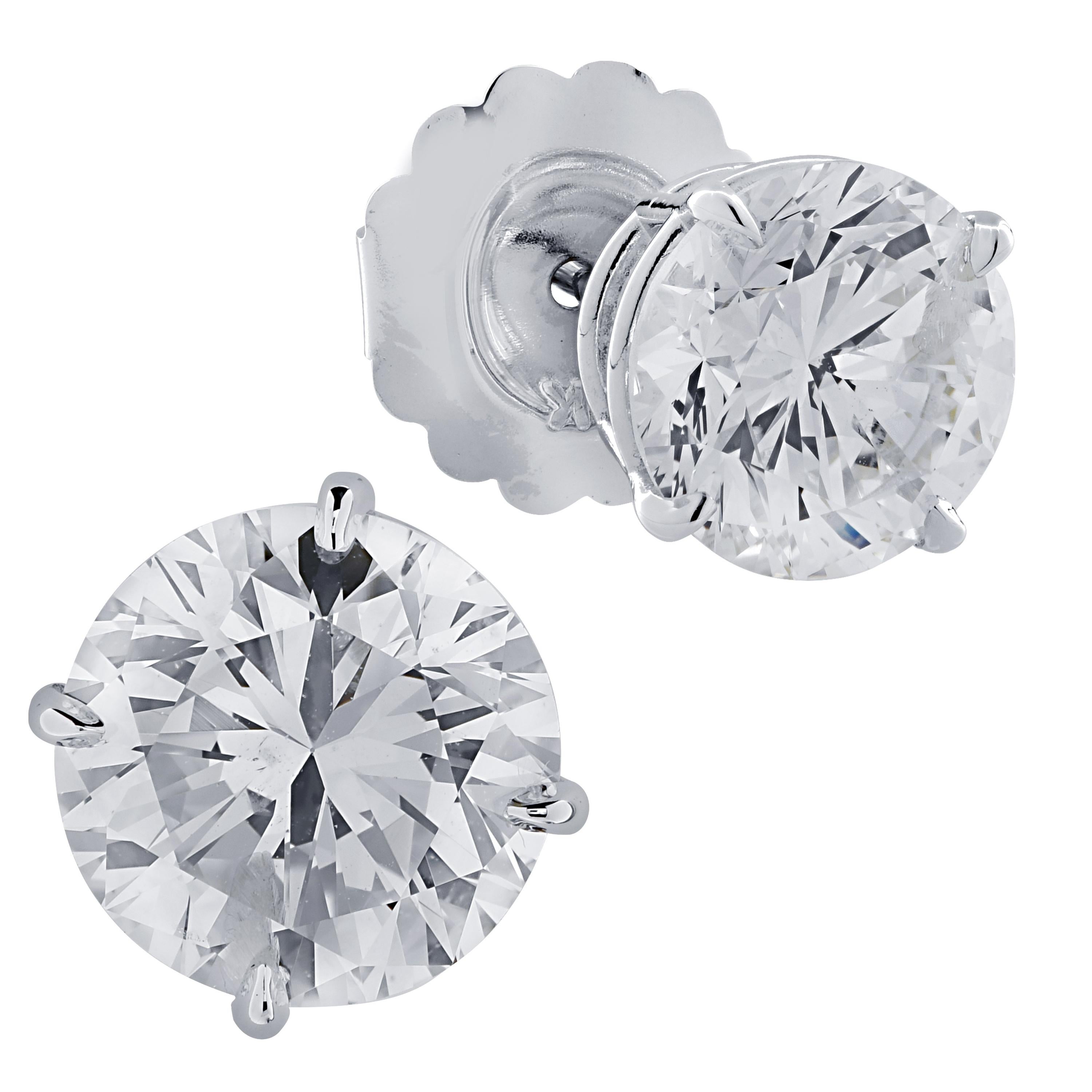Stunning solitaire stud earrings crafted in 18 karat white gold, showcasing 2 round brilliant cut diamonds weighing 5.83 carats total, M color I1 clarity. These gorgeous earrings are classic and timelessly elegant.

Our pieces are all accompanied by
