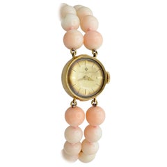 Baume et Mercier Montre-bracelet pour femme mécanique perles de corail or 14 carats