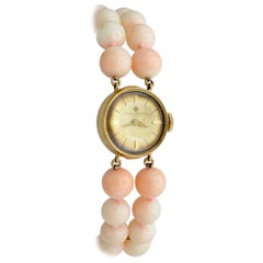 Baume et Mercier Montre-bracelet mécanique pour femme en or 14 carats, perles de corail et perles