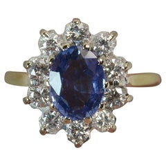 Beautiful Ceylon Sapphire and 0.60 Carat Diamond 18 Carat Gold Cluster Ring