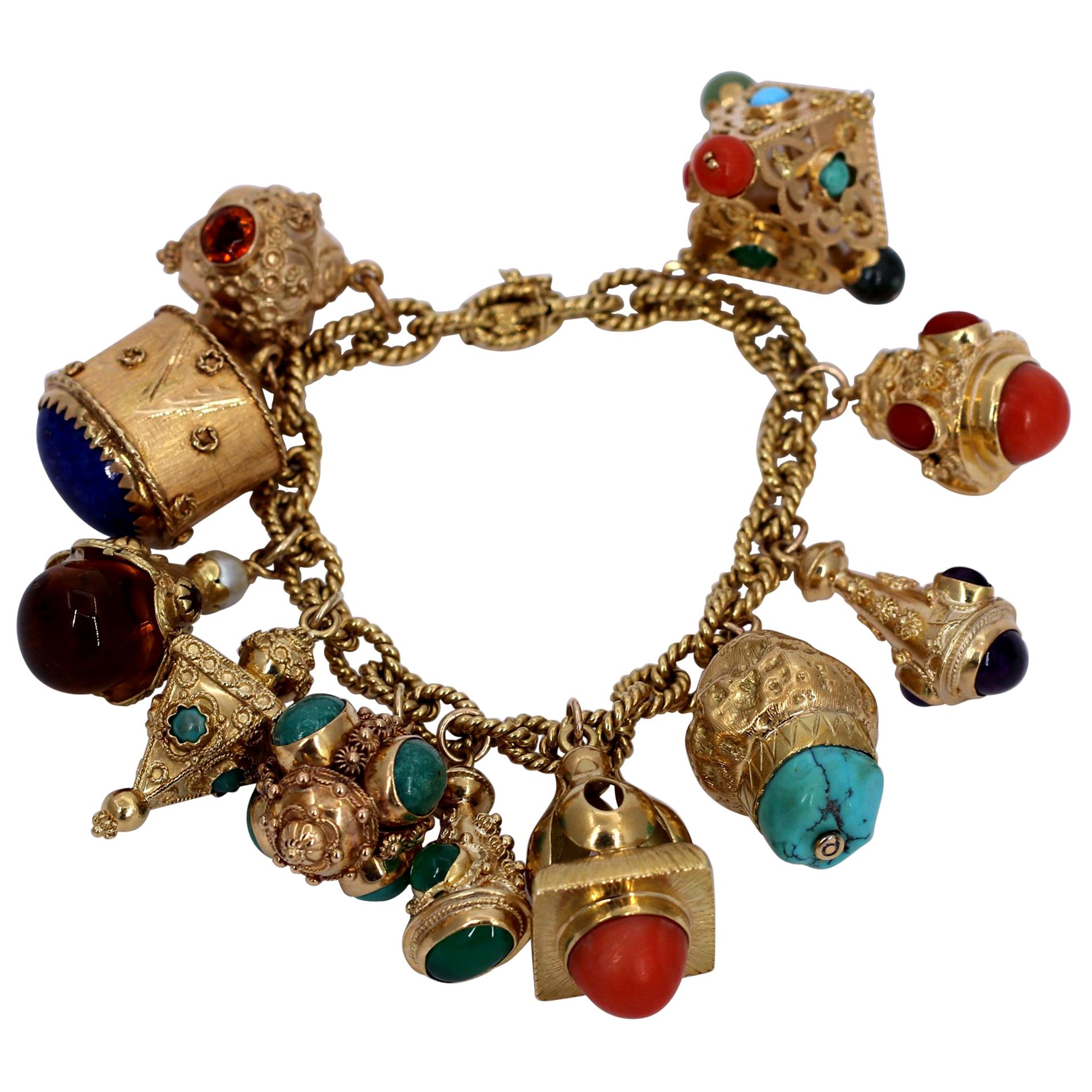 Gold Charm Bracelet with Eleven Charms with Assorted Stones