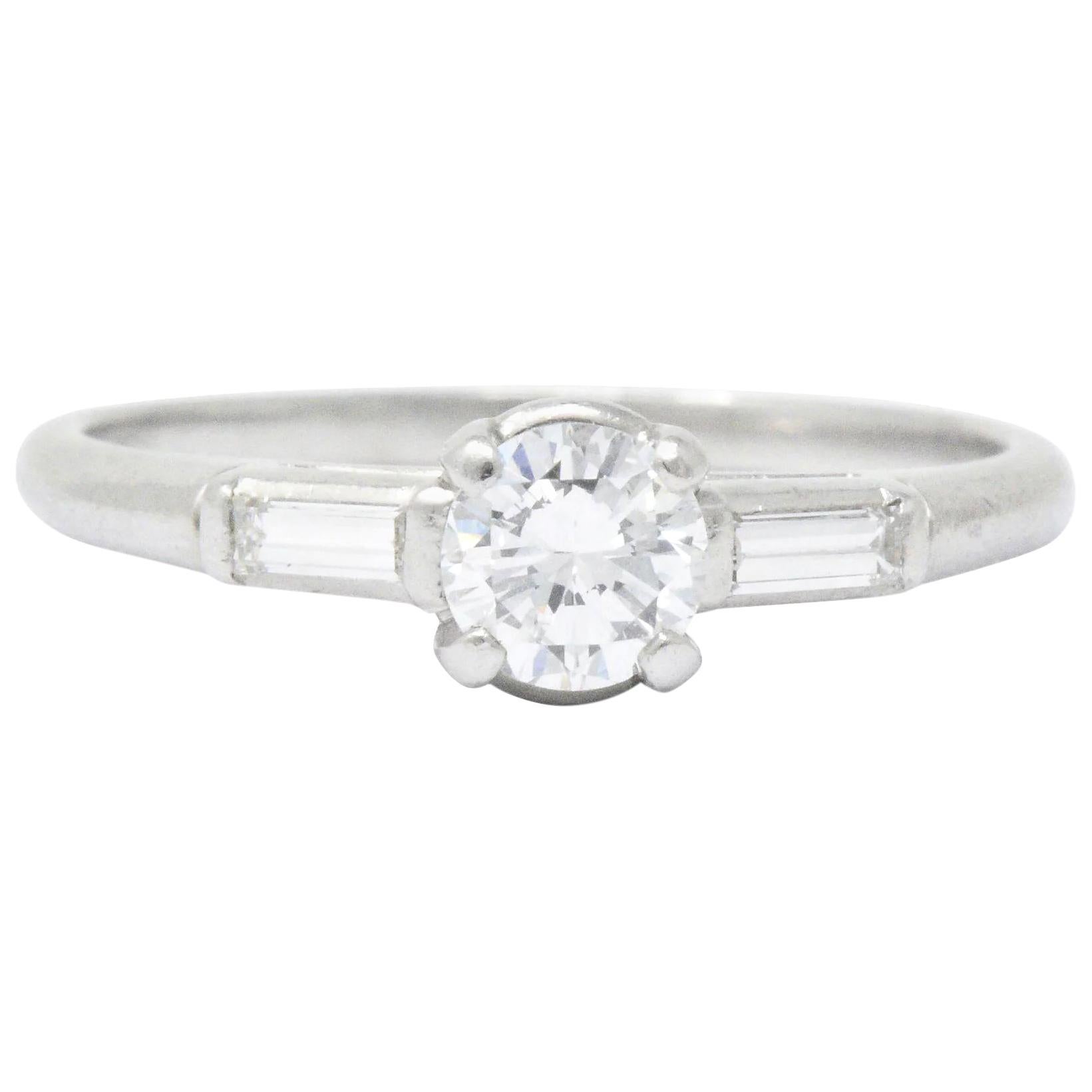 Retro 0.65 Carat Diamond Platinum Three Stone Engagement Ring