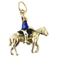 9 Karat Yellow Gold and Enamel Soldier on Horse Charm